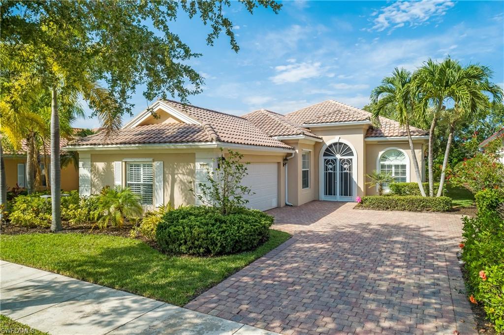 Street view of home with side load garage