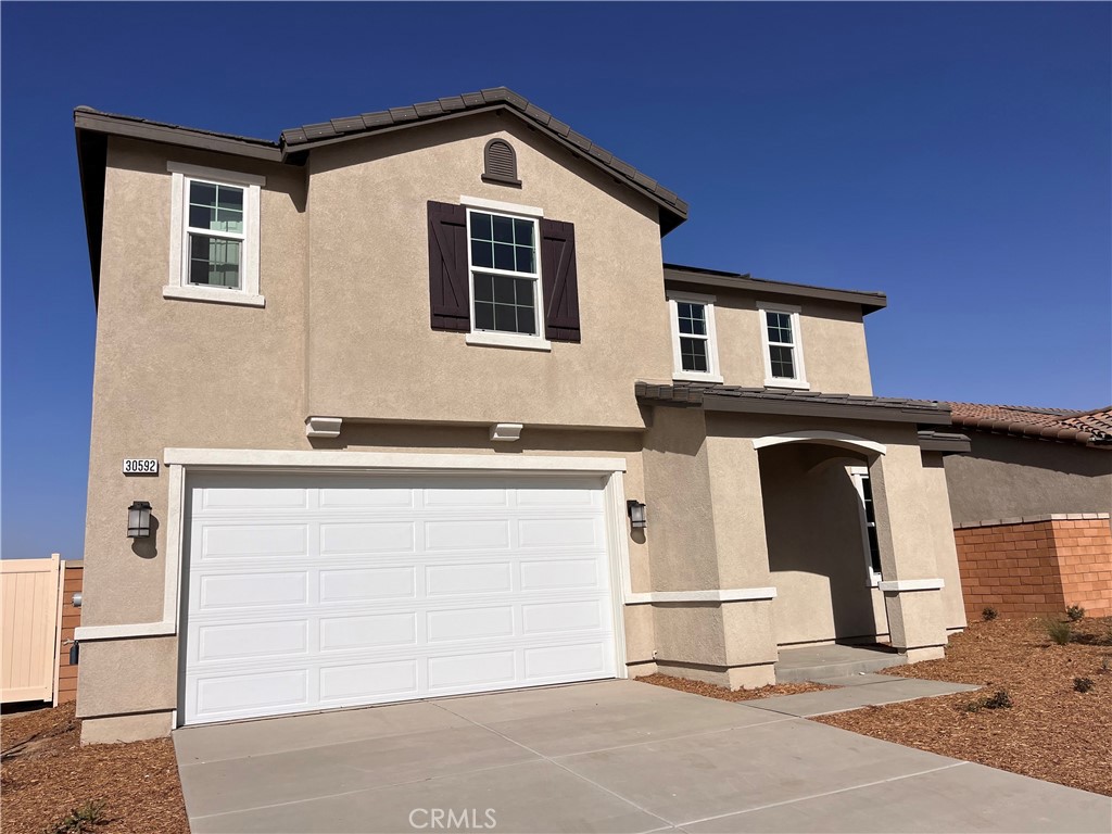 a front view of a house with a garage