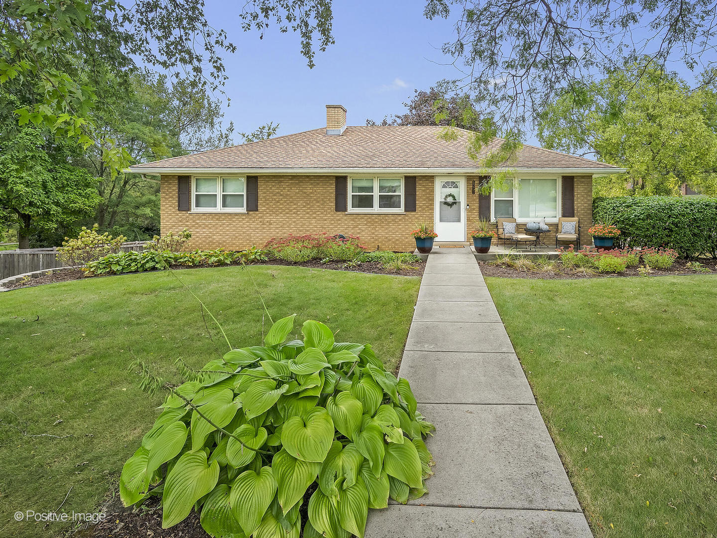 a front view of a house with yard