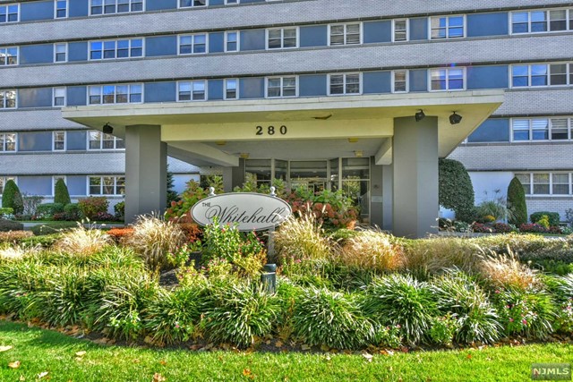 a front view of a multi story residential apartment building