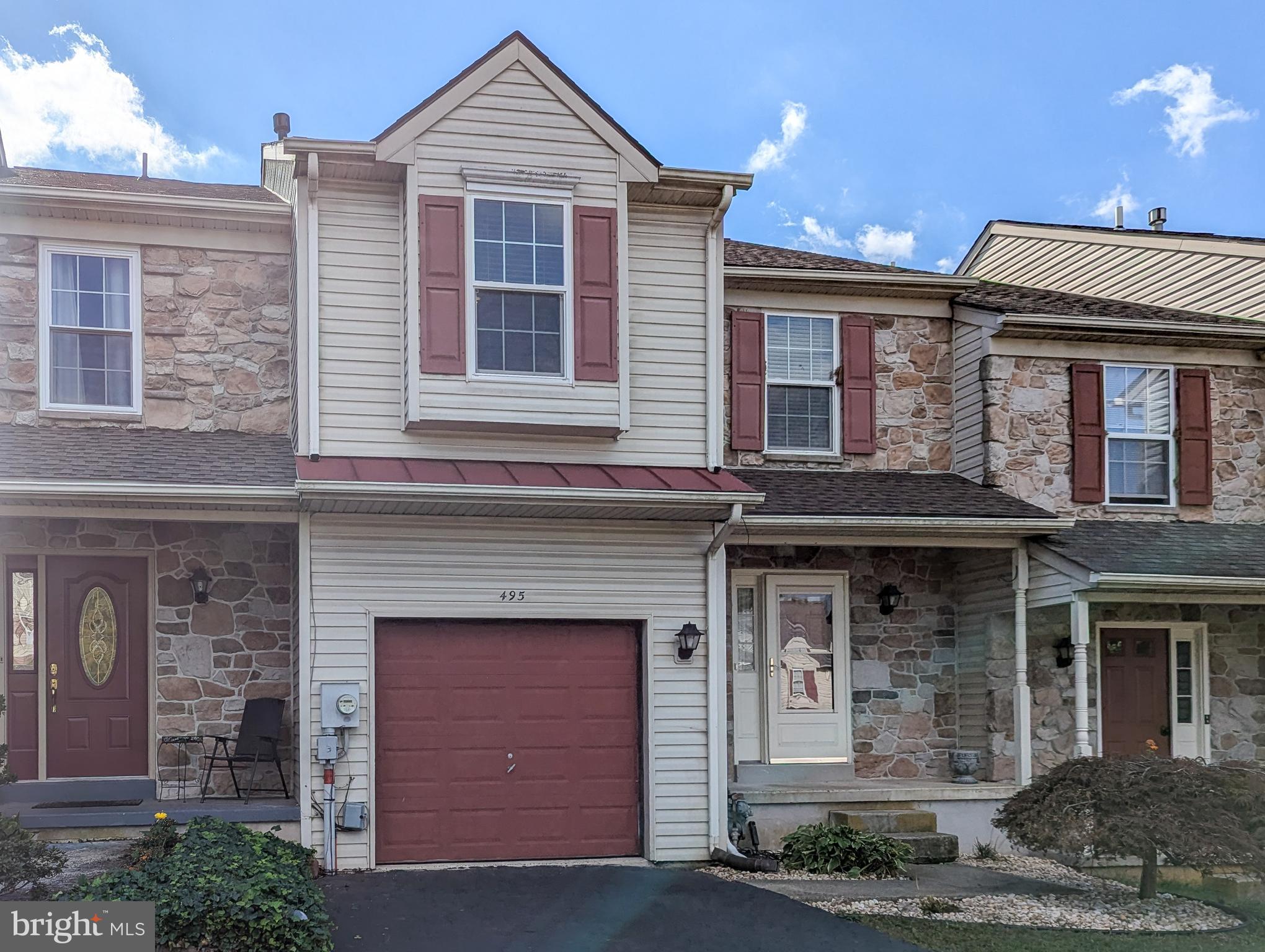 a front view of a house with yard