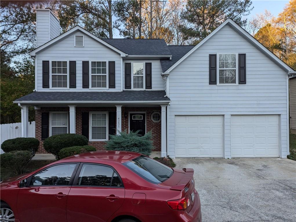 a front view of a house with yard