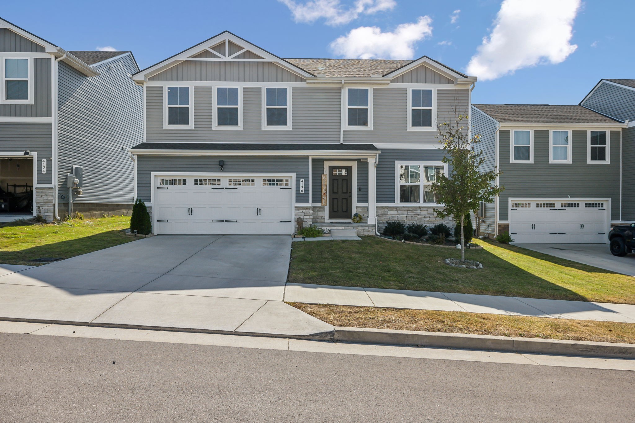 a front view of a house with a yard