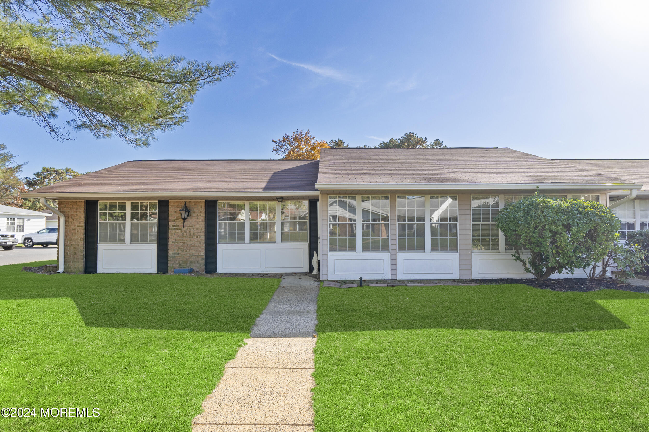 a view of a house with a yard