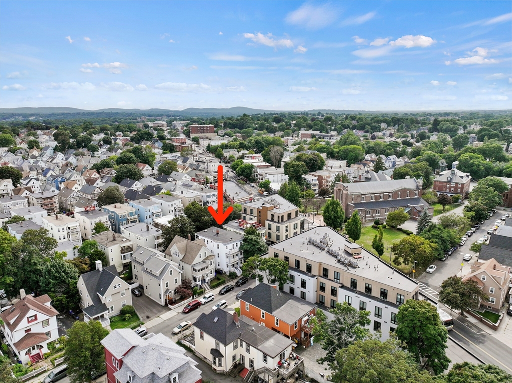 an aerial view of a city with lots of residential buildings