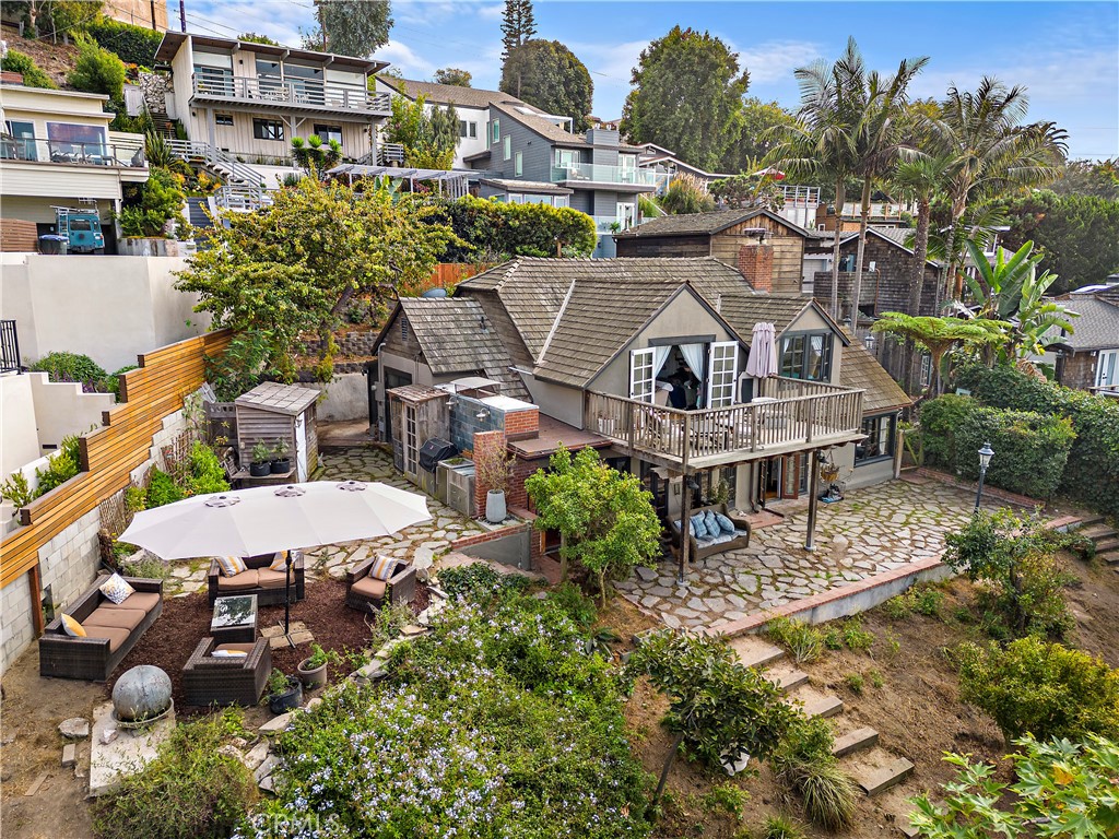 an aerial view of multiple houses with yard