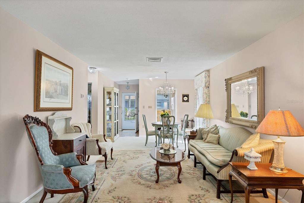 a living room with furniture and a lamp