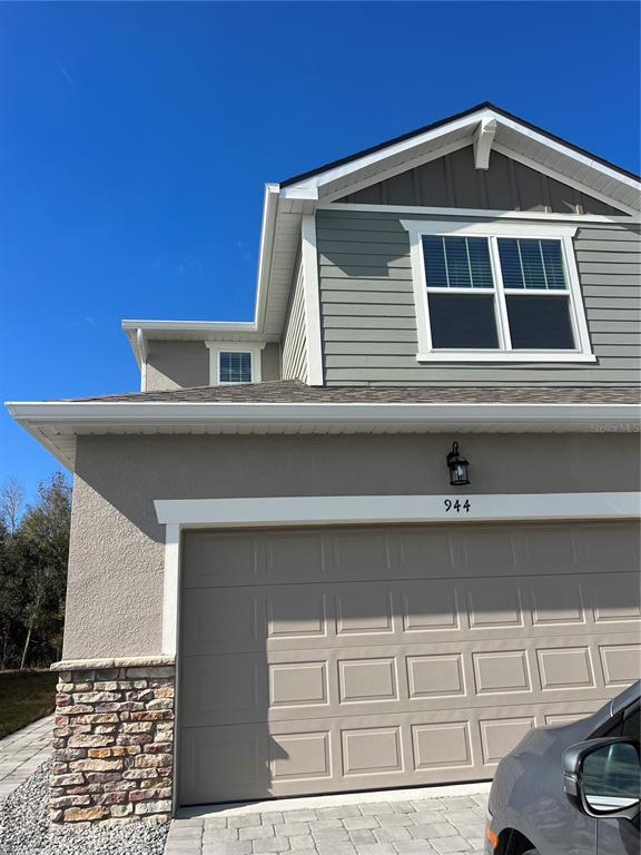 a front view of a house with white walls