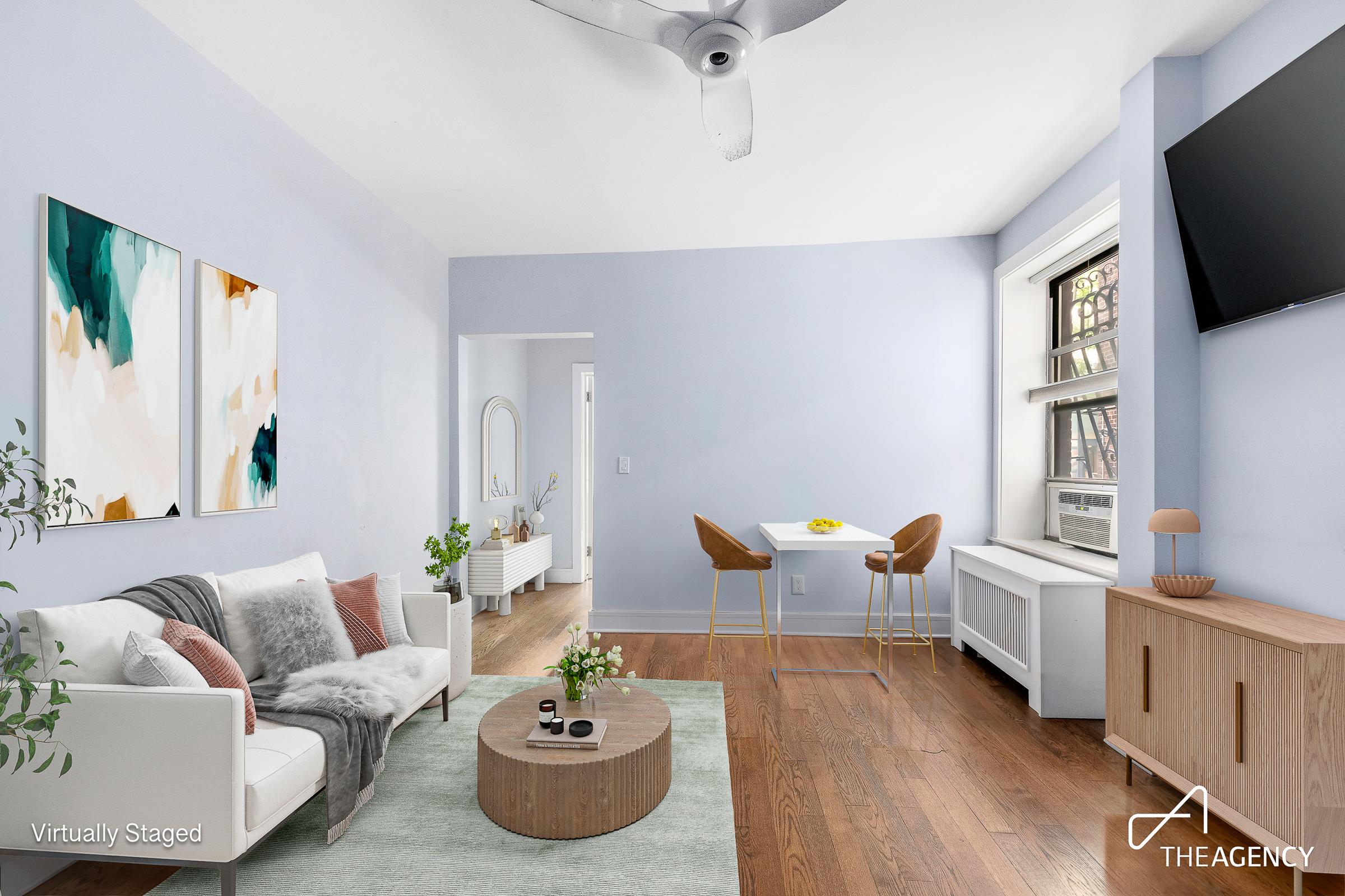 a living room with furniture and a flat screen tv