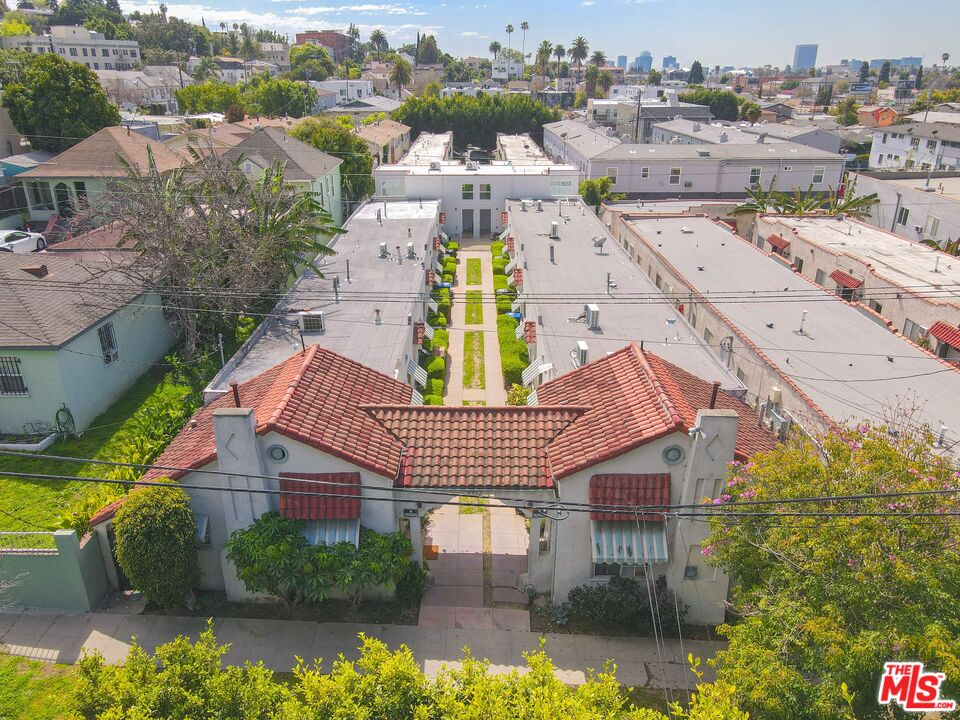 an aerial view of residential houses with yard