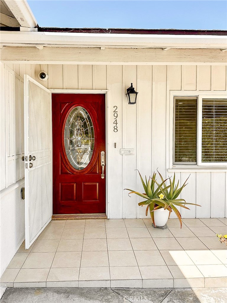 a view of a entryway door with wooden floor