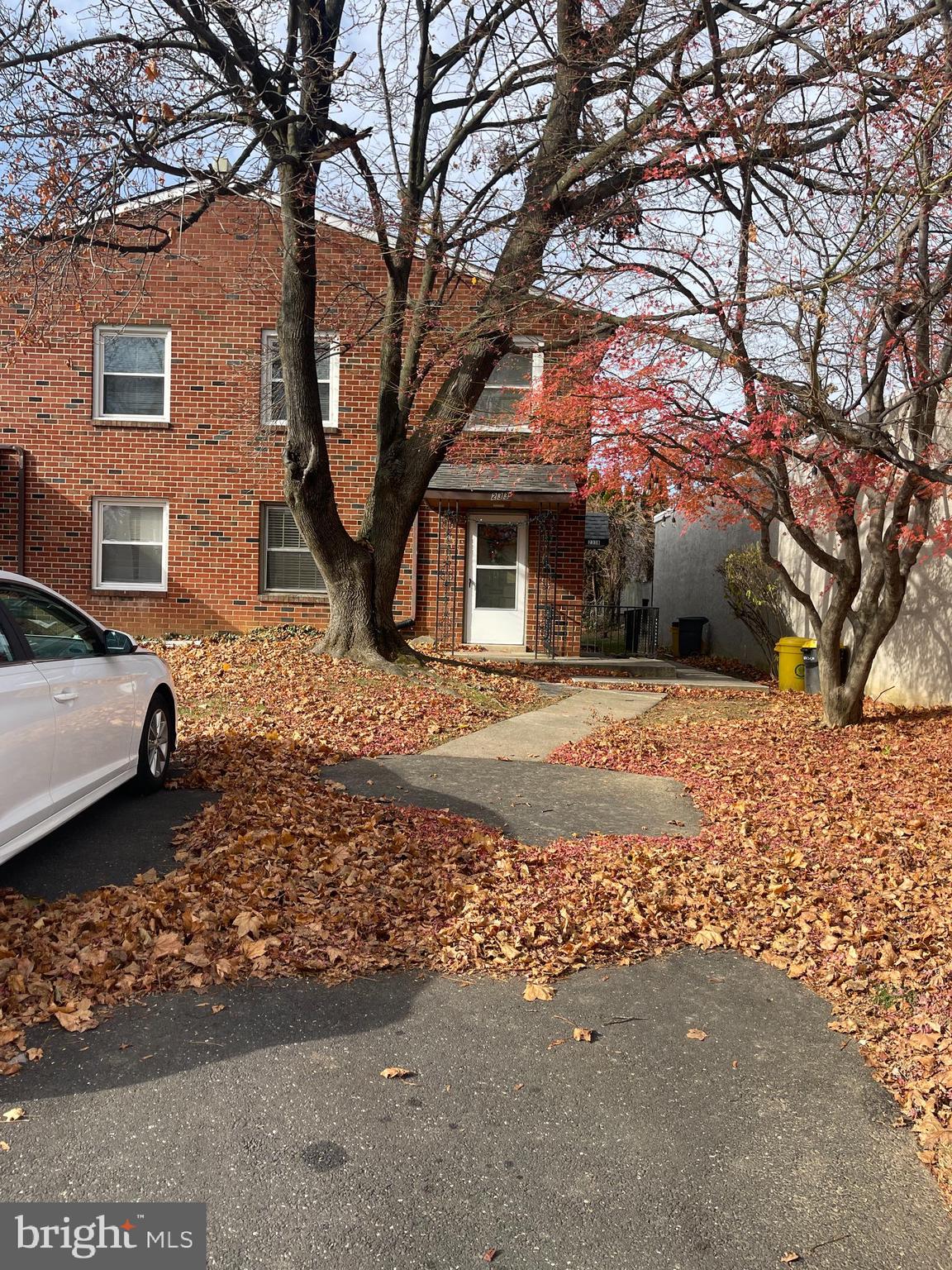 a house that has a tree in front of it