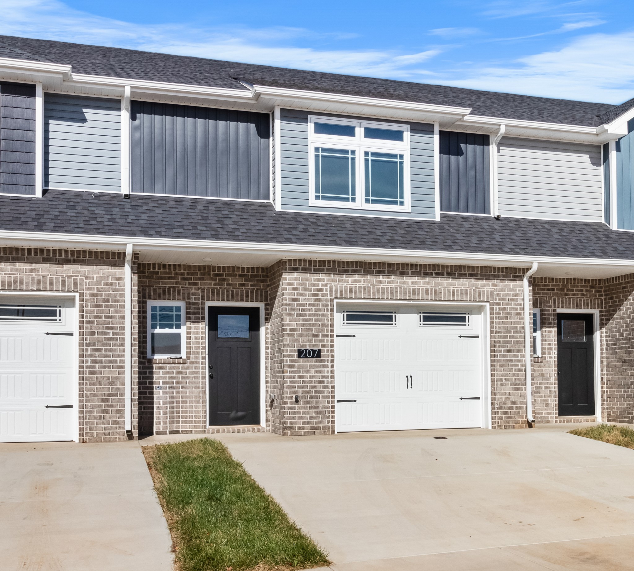 a front view of a house with a garage