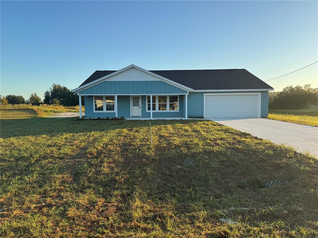 a front view of a house with yard