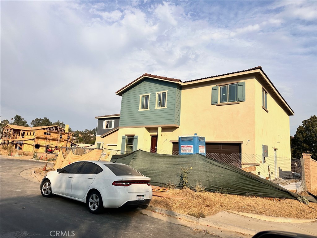 a view of a car parked in front of a house