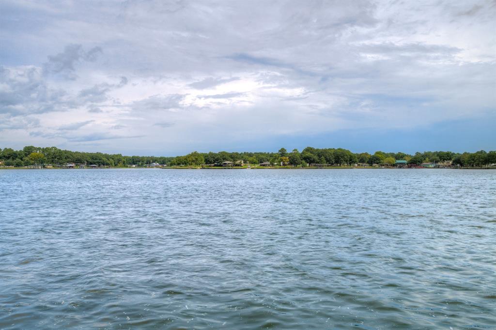 a view of a lake and a big yard