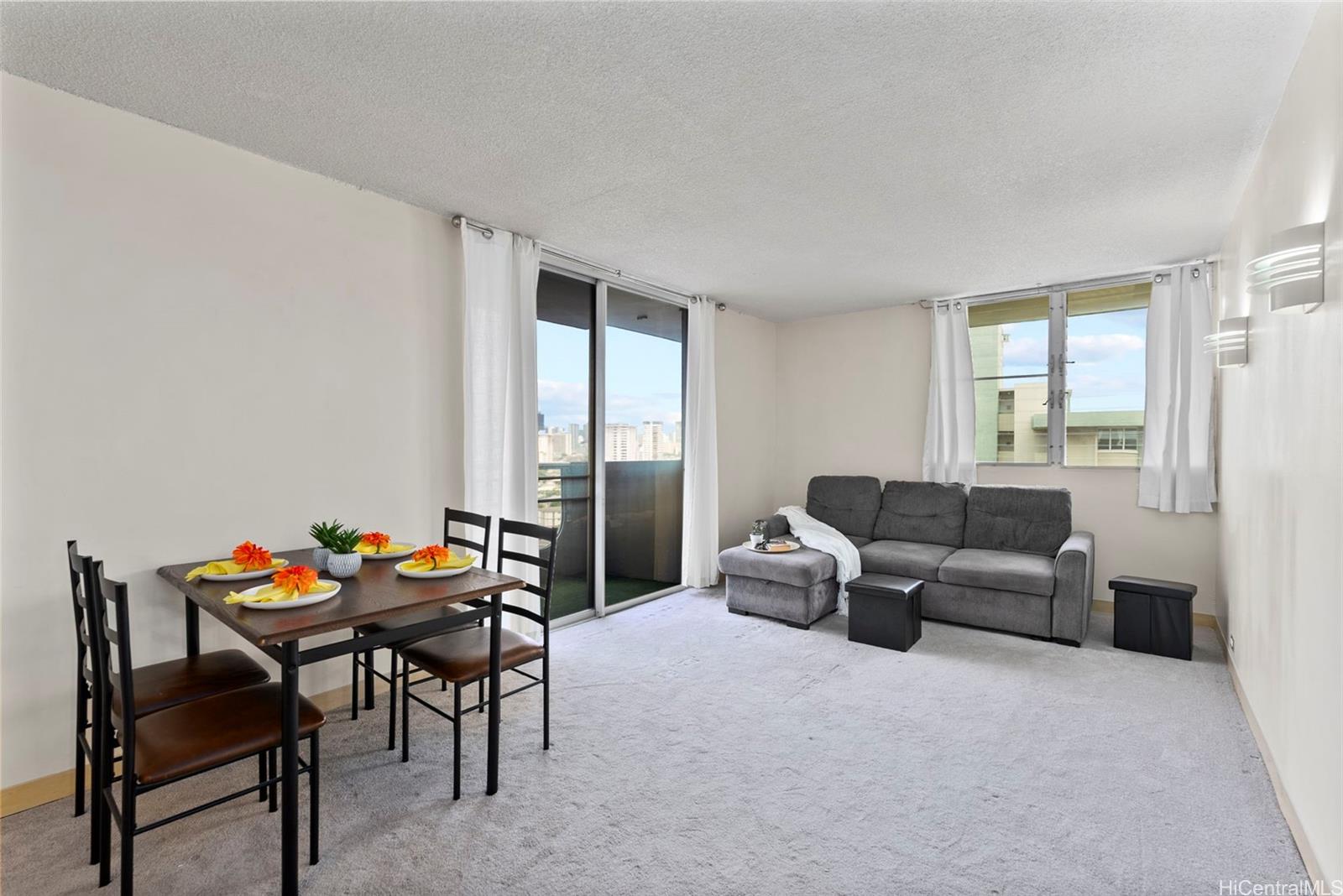 a living room with furniture and a window