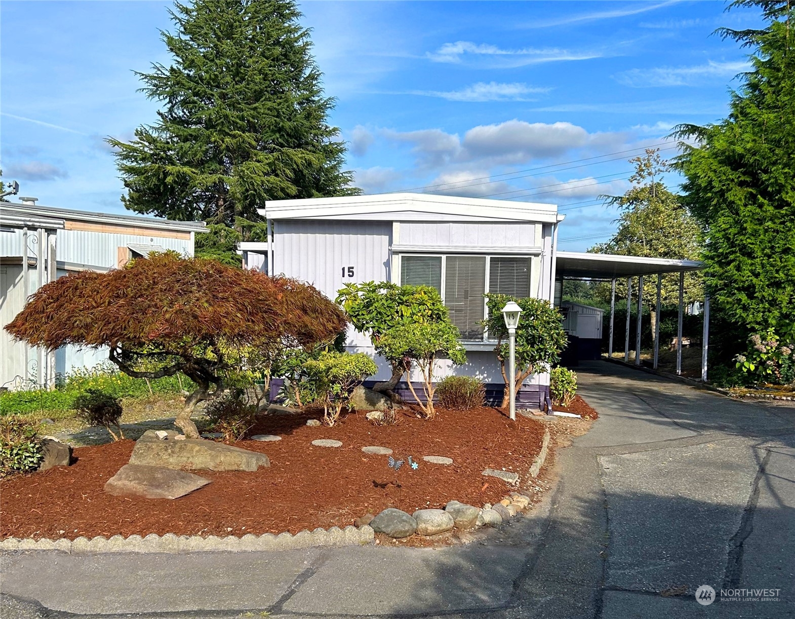 a view of a house with sitting area and garden