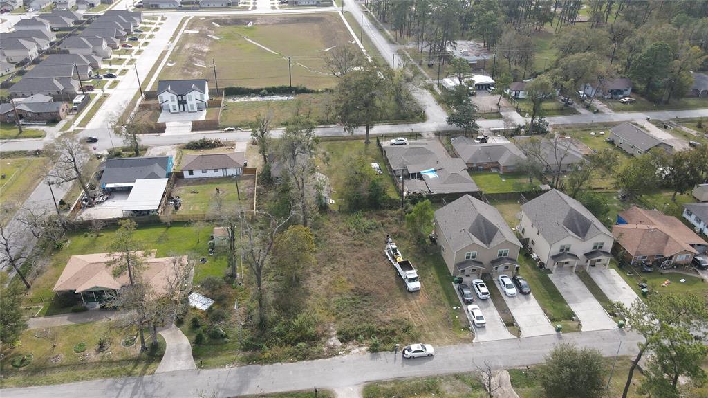 an aerial view of residential houses with outdoor space