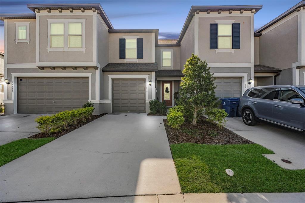 a view of a car parked in front of a house