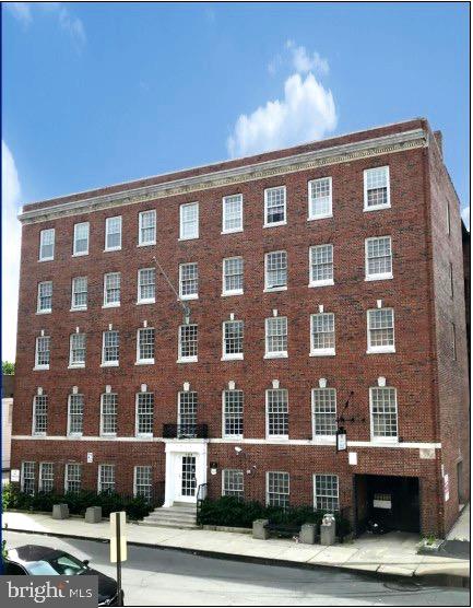 a front view of a building with windows