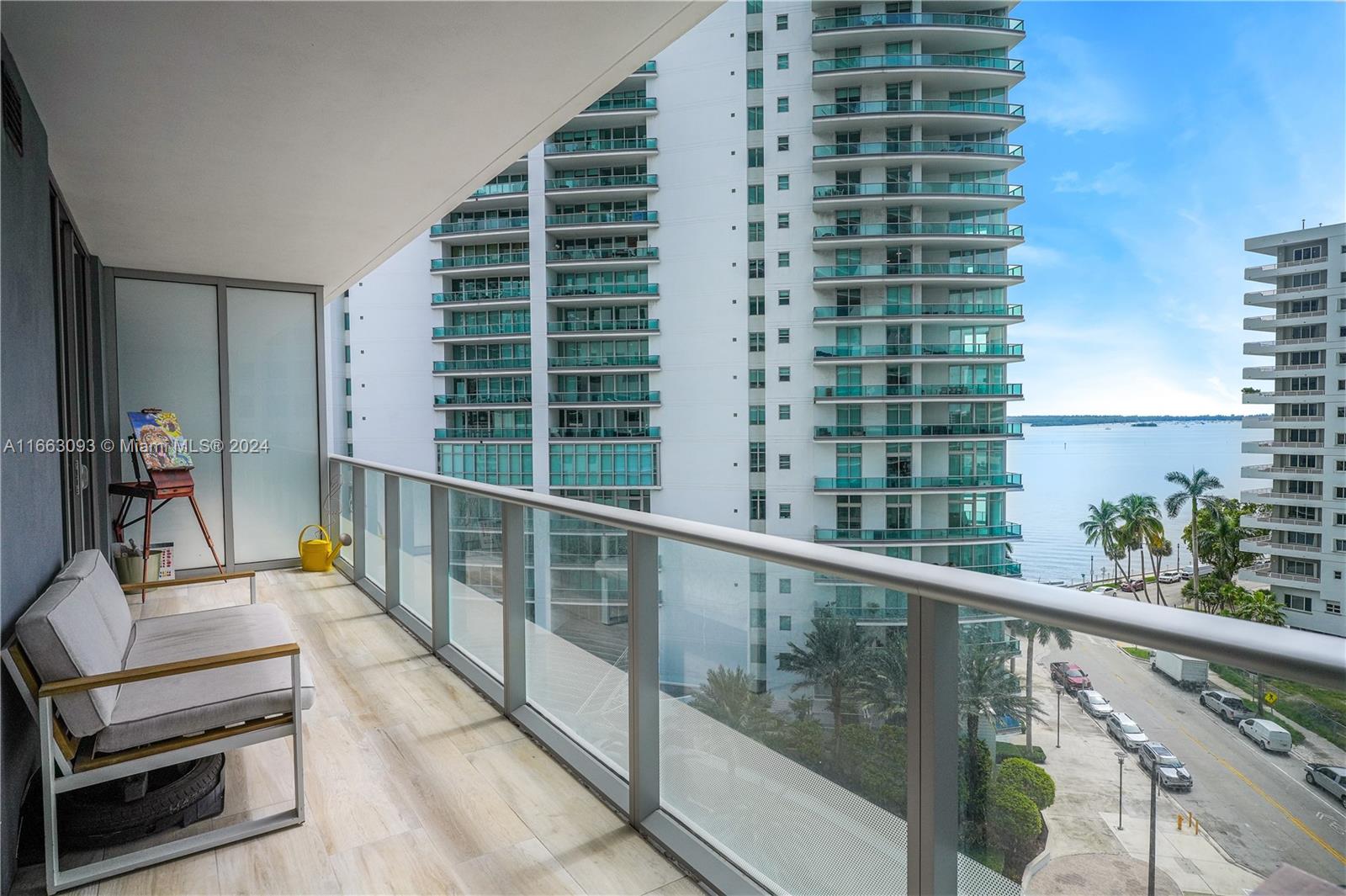 a view of balcony with wooden floor