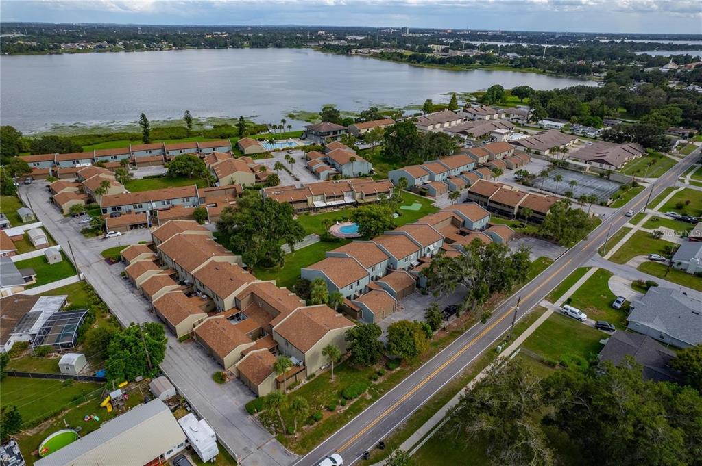 an aerial view of a city with lake view