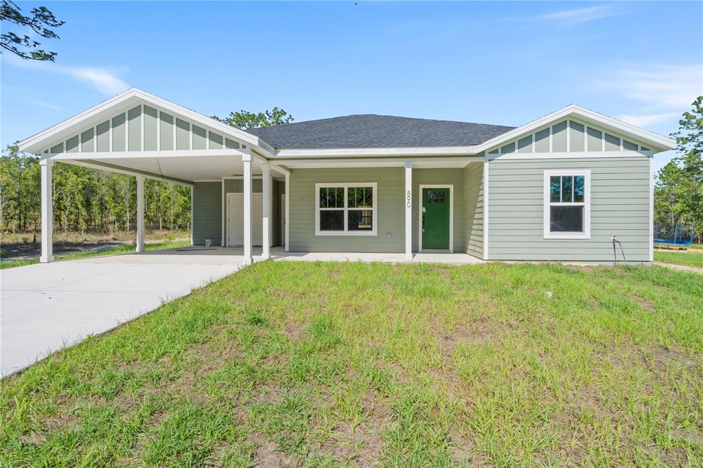 front view of a house with a yard