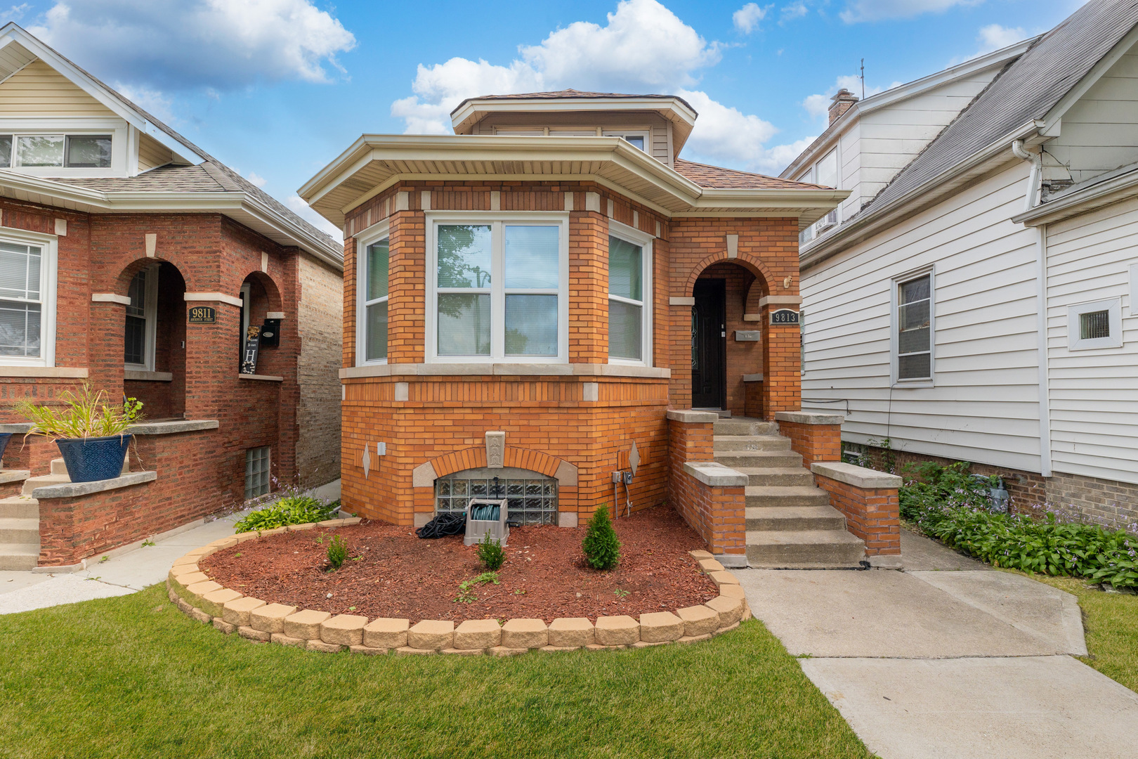 a front view of a house with a yard