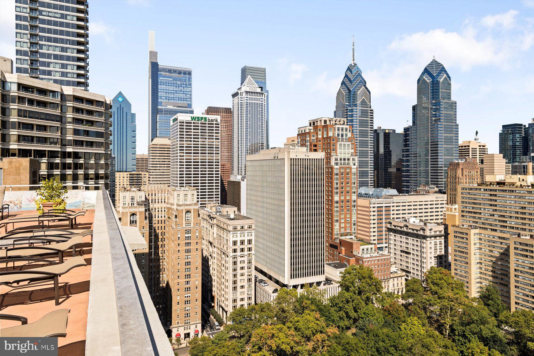 a view of city with tall buildings