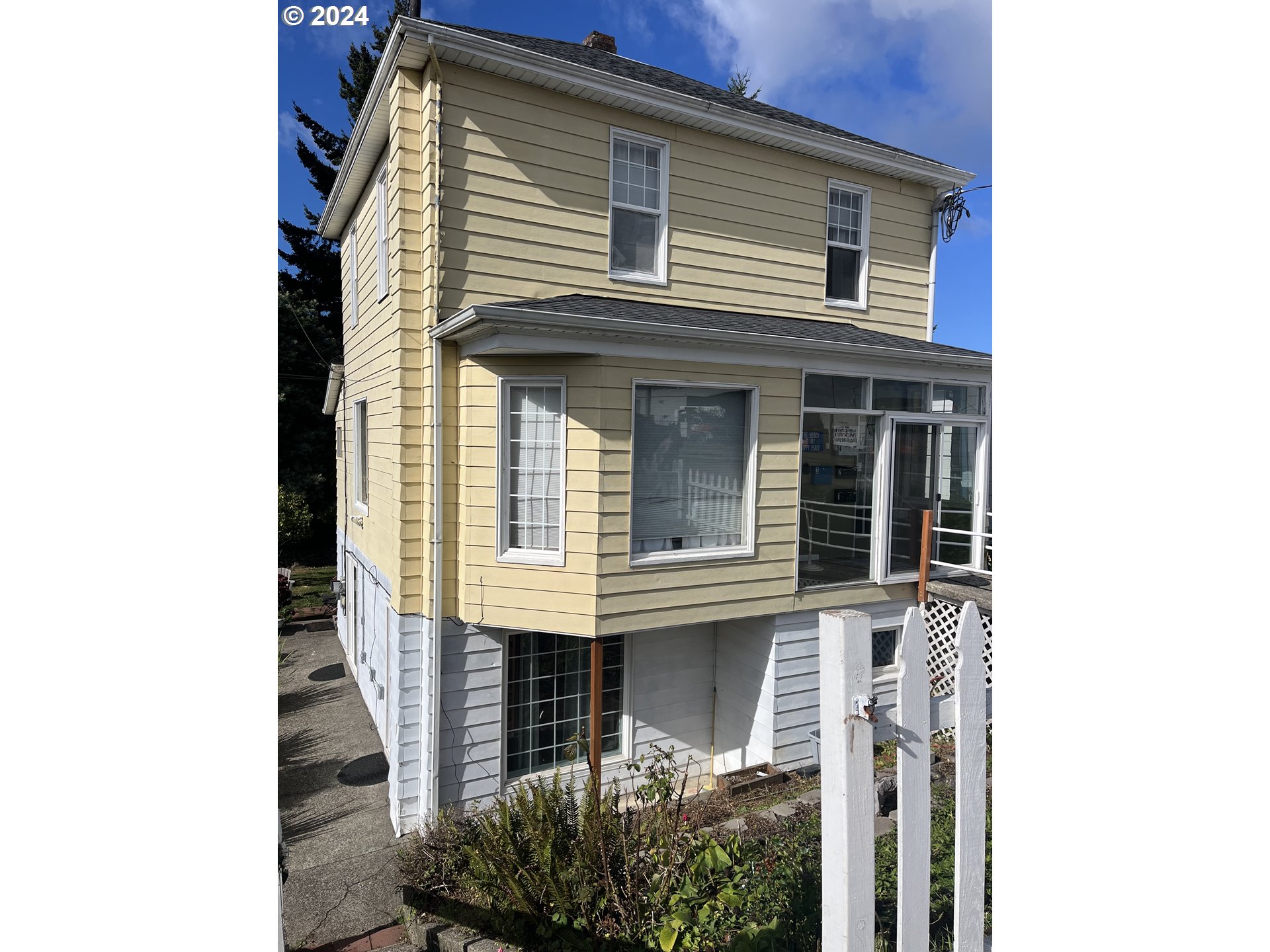 a front view of a house with stairs