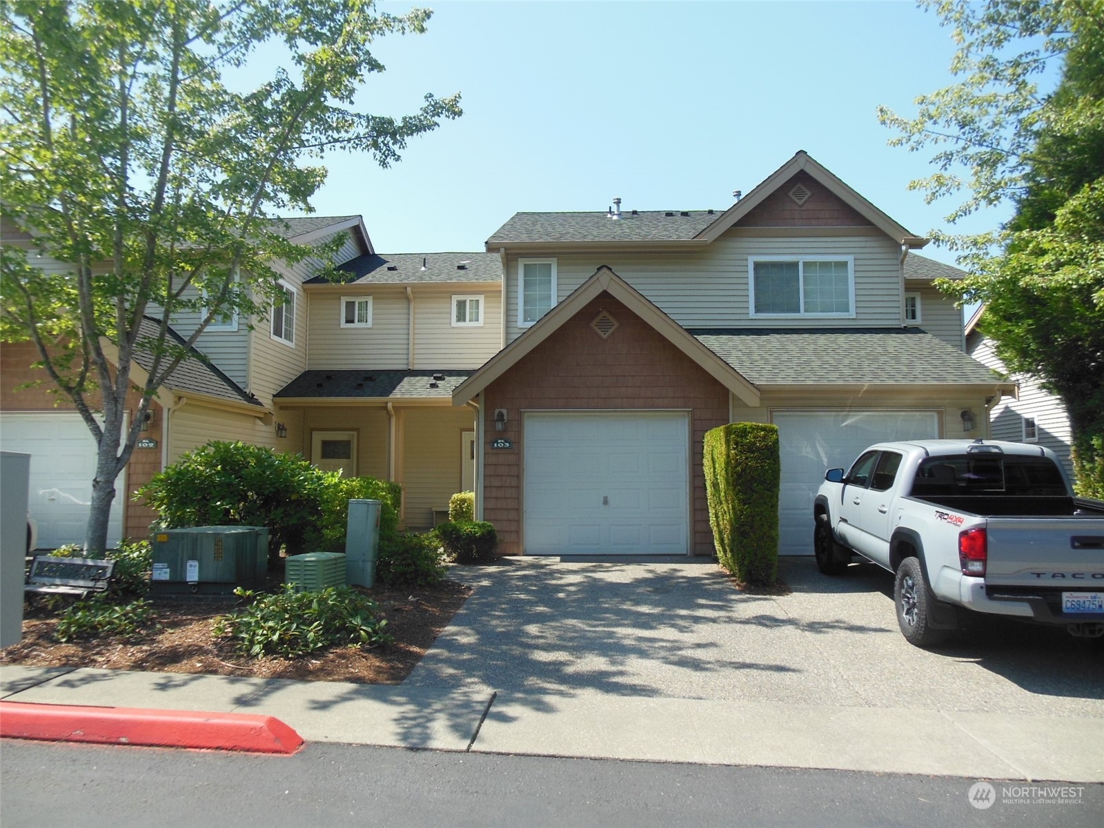 a view of a car park in front of house