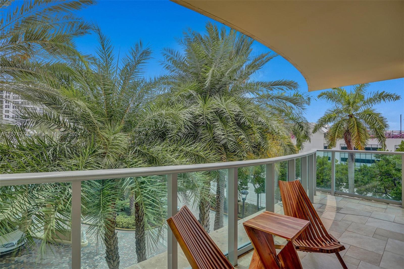 a view of a balcony with chairs