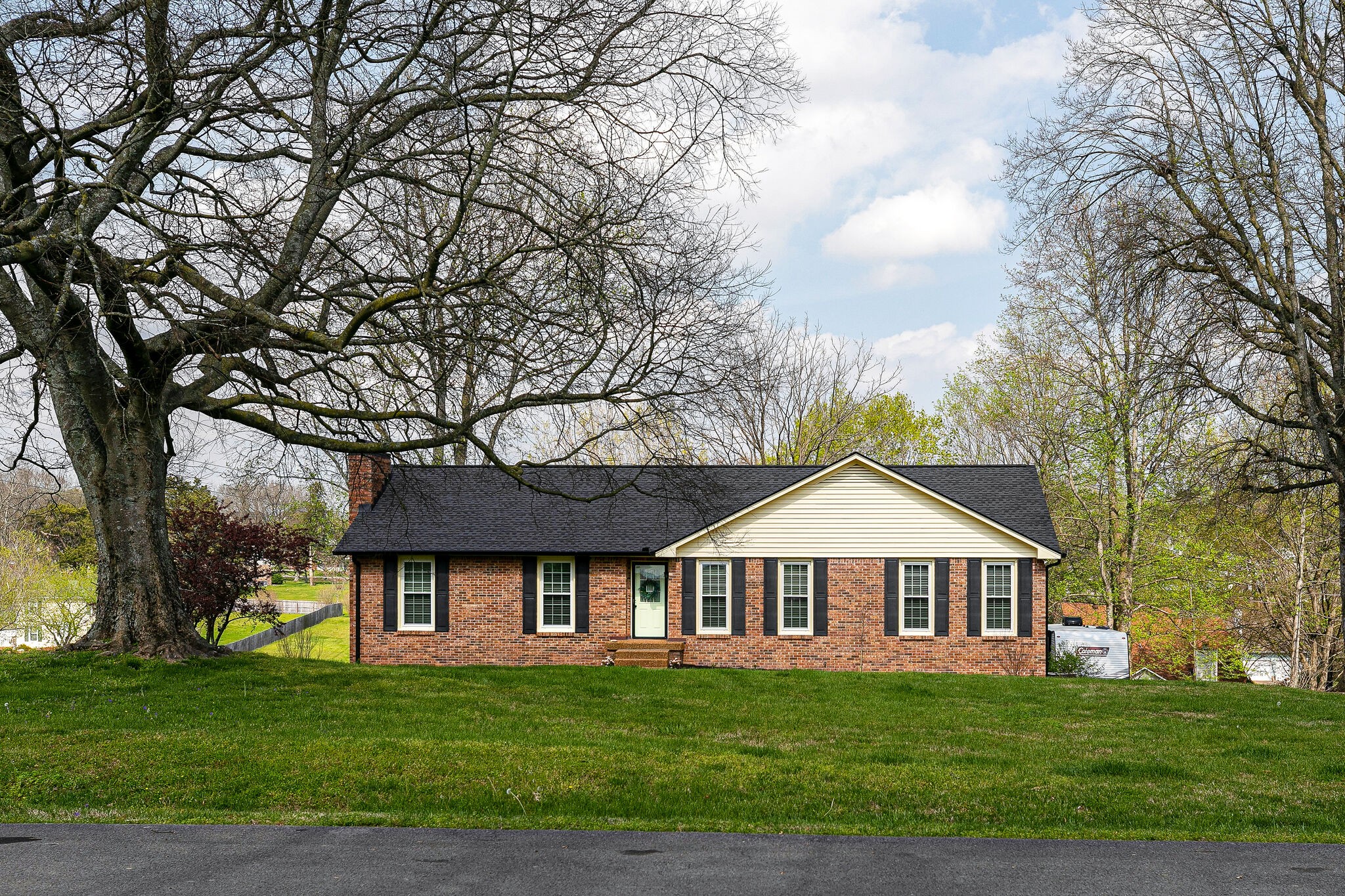 a front view of a house with a yard