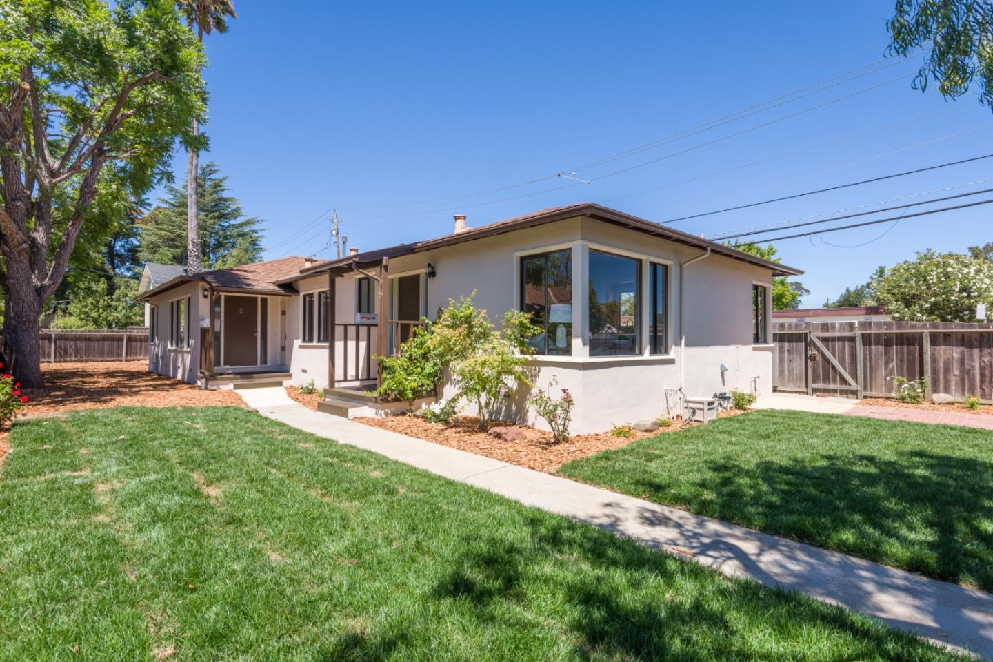 a front view of house with yard and outdoor seating