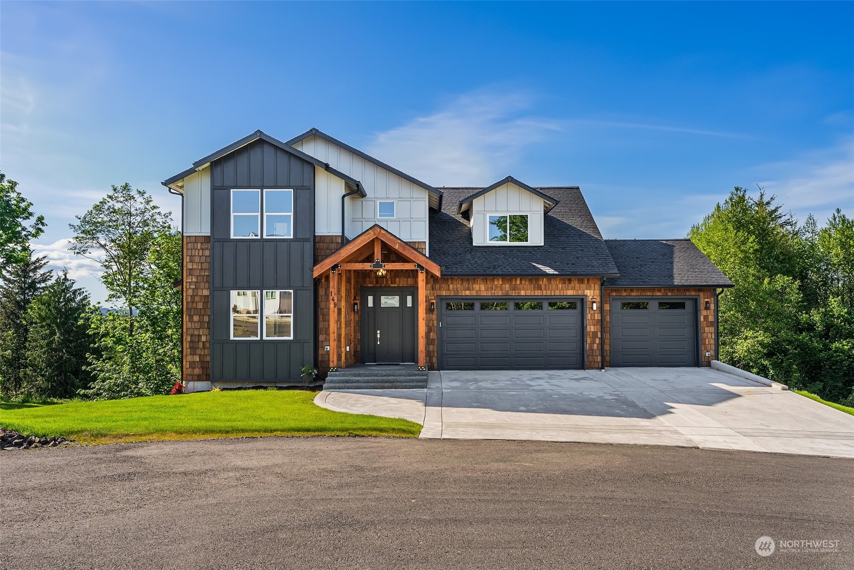 a front view of house with yard and green space