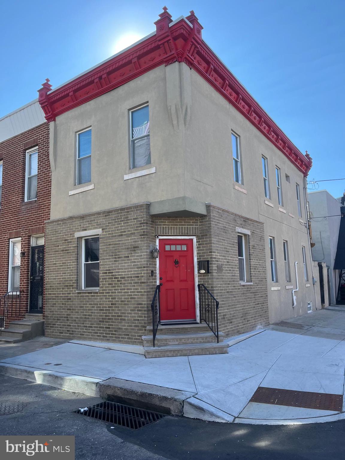 a view of a brick building with many windows