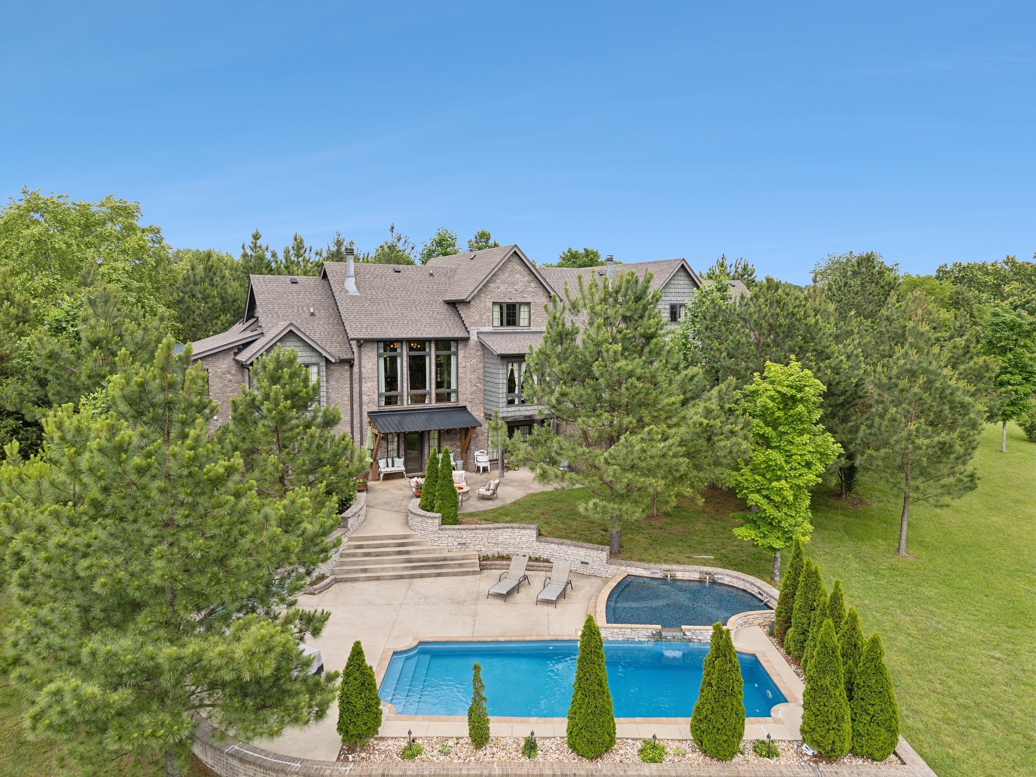 an aerial view of a house with outdoor space and street view