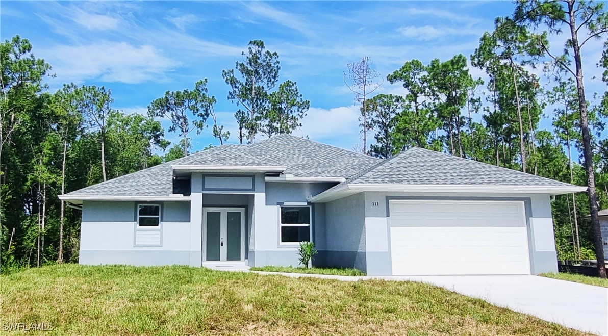 front view of a house with a yard