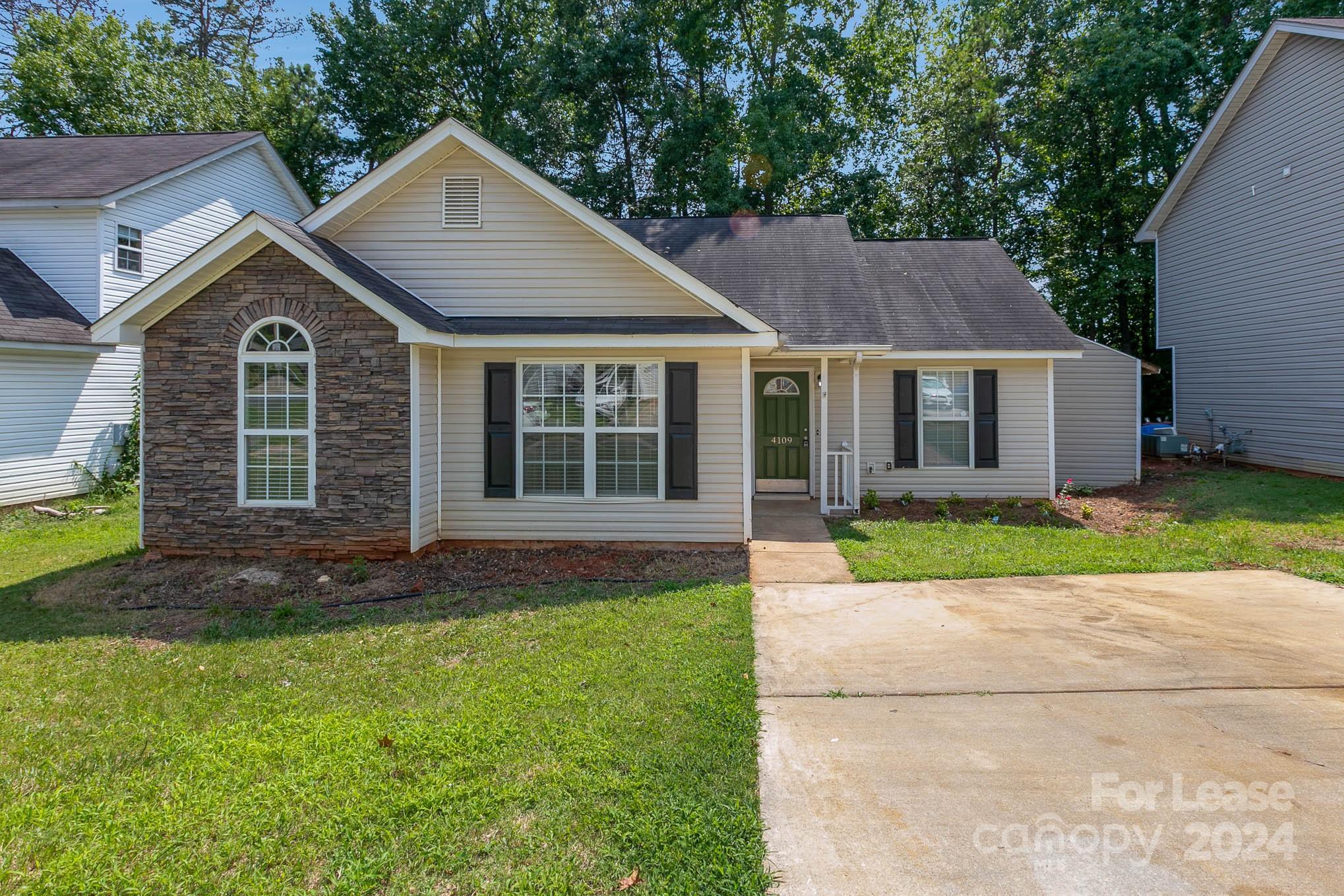 front view of a house with a yard