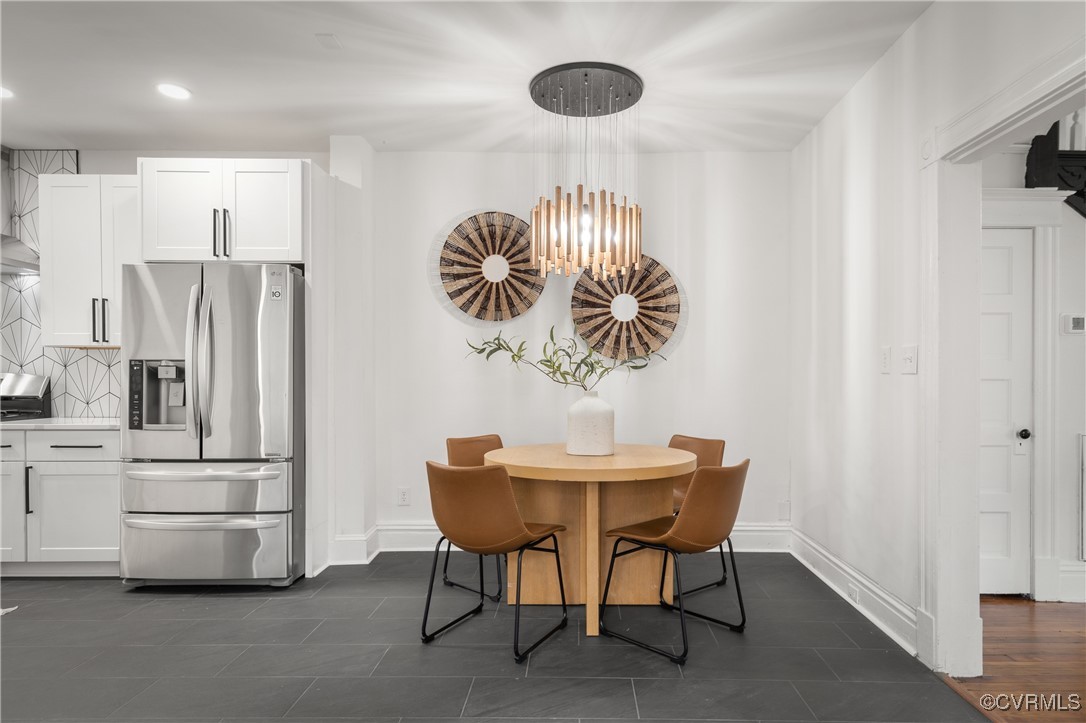 Dining area featuring a notable chandelier