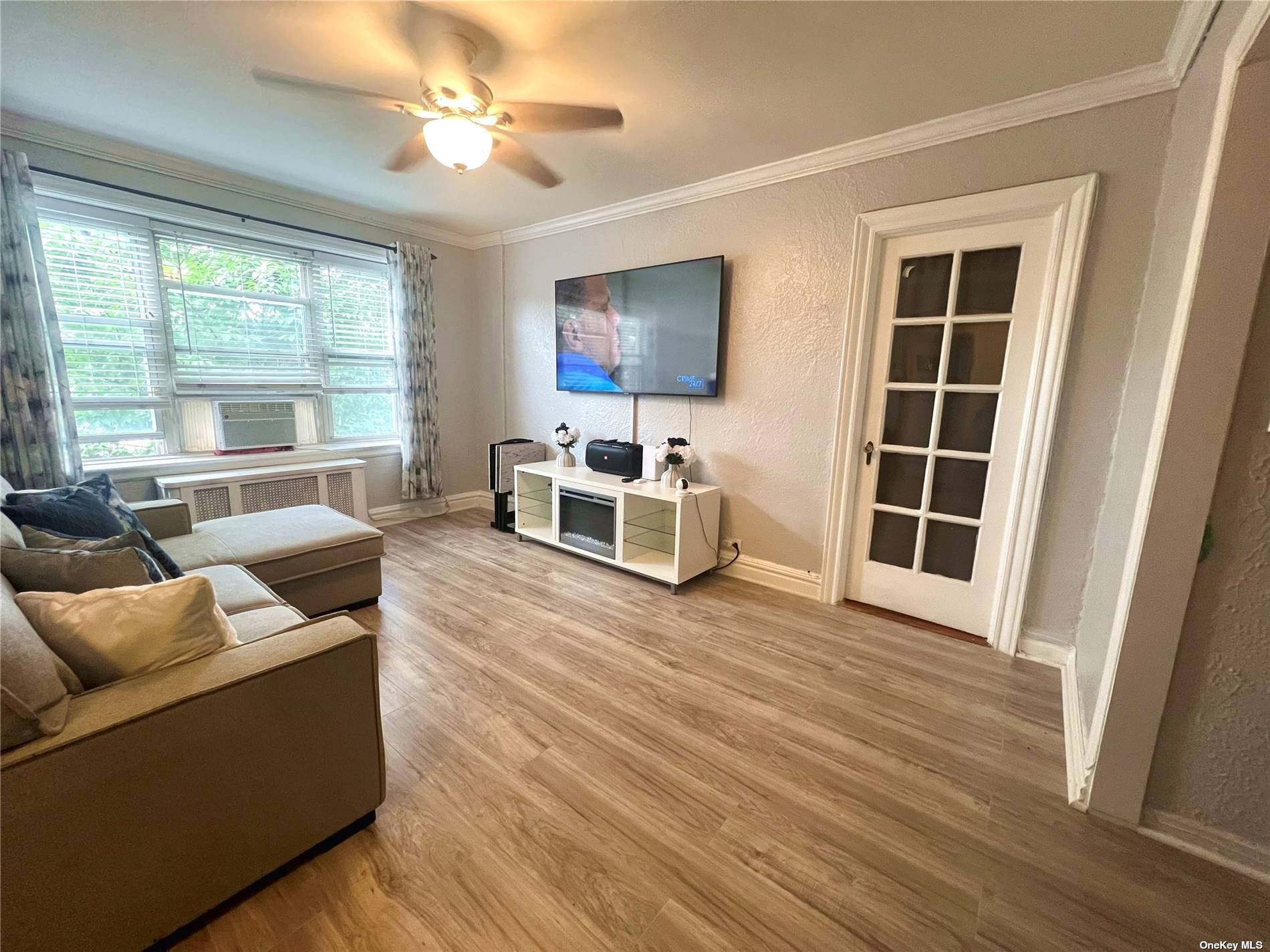 a living room with furniture and a window