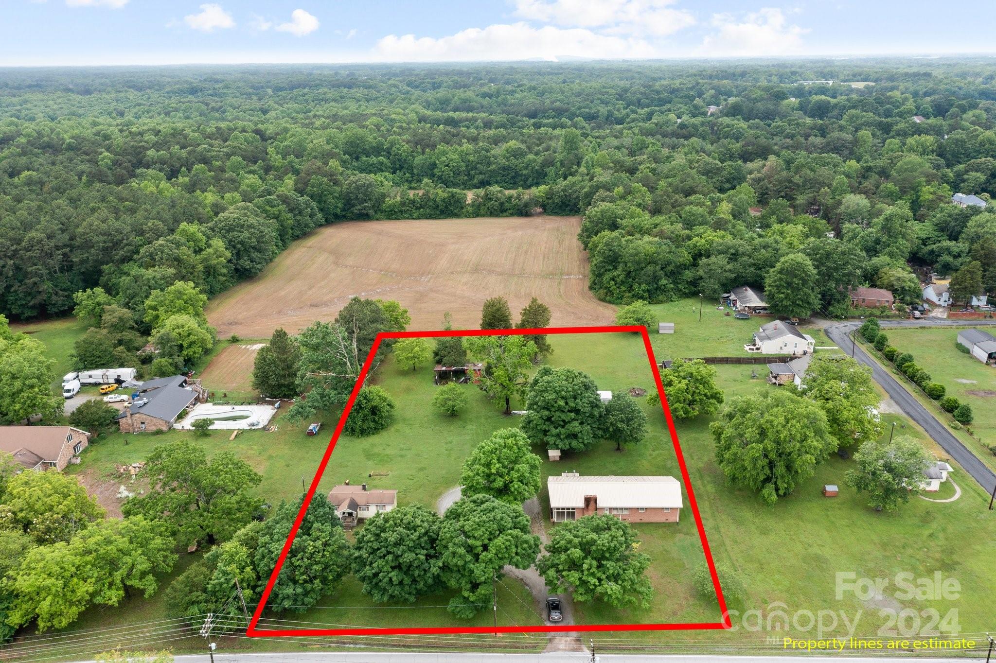 an aerial view of house with yard