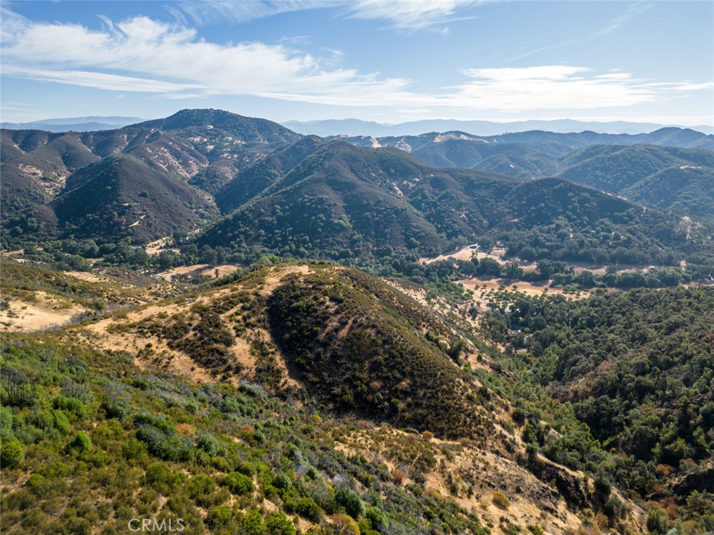 a view of a field with a mountain