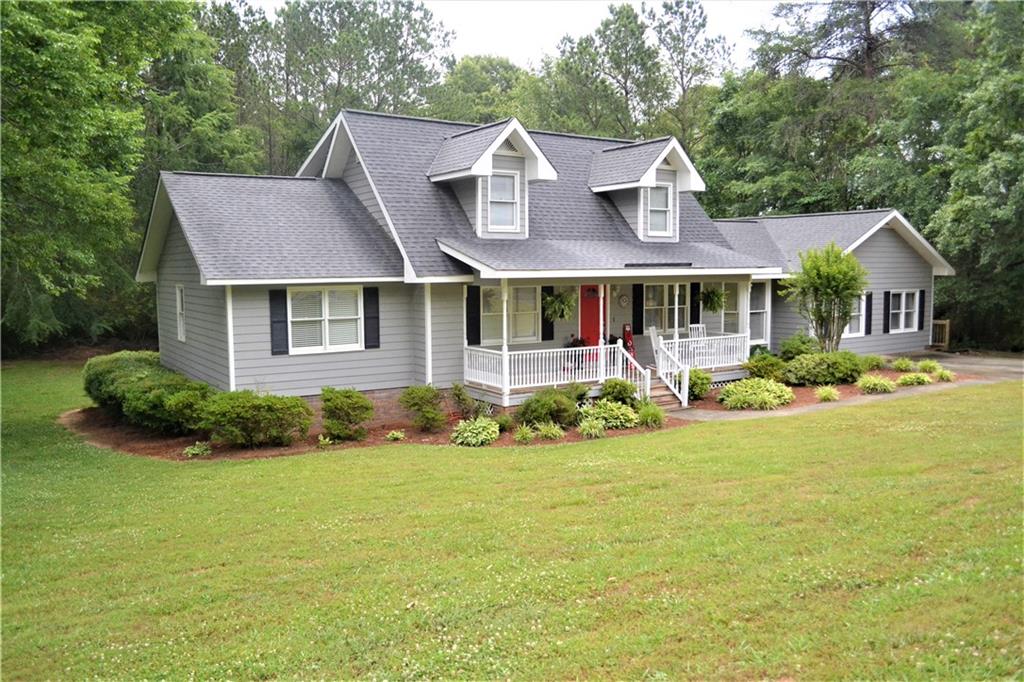 a front view of a house with garden