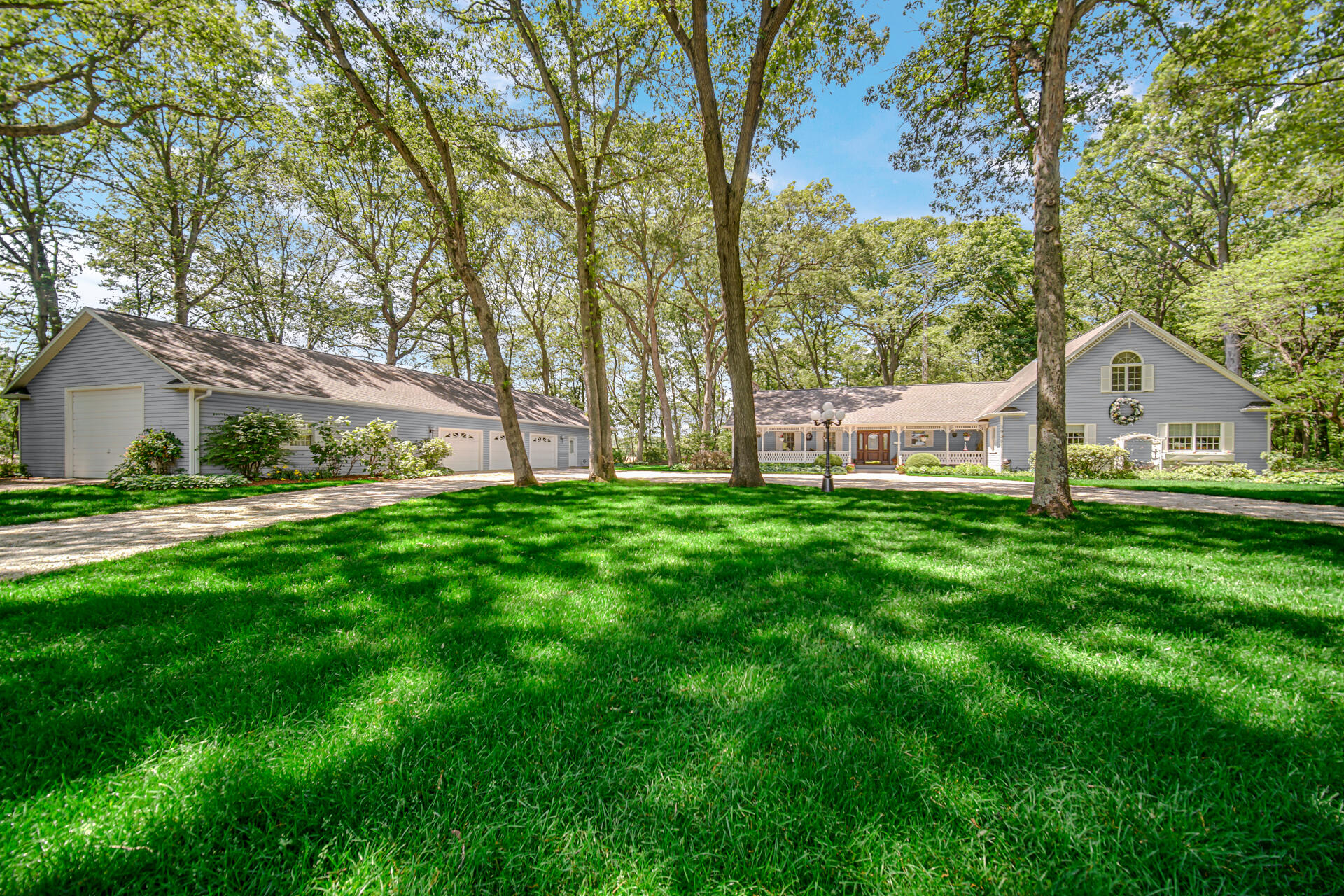 a view of house with backyard