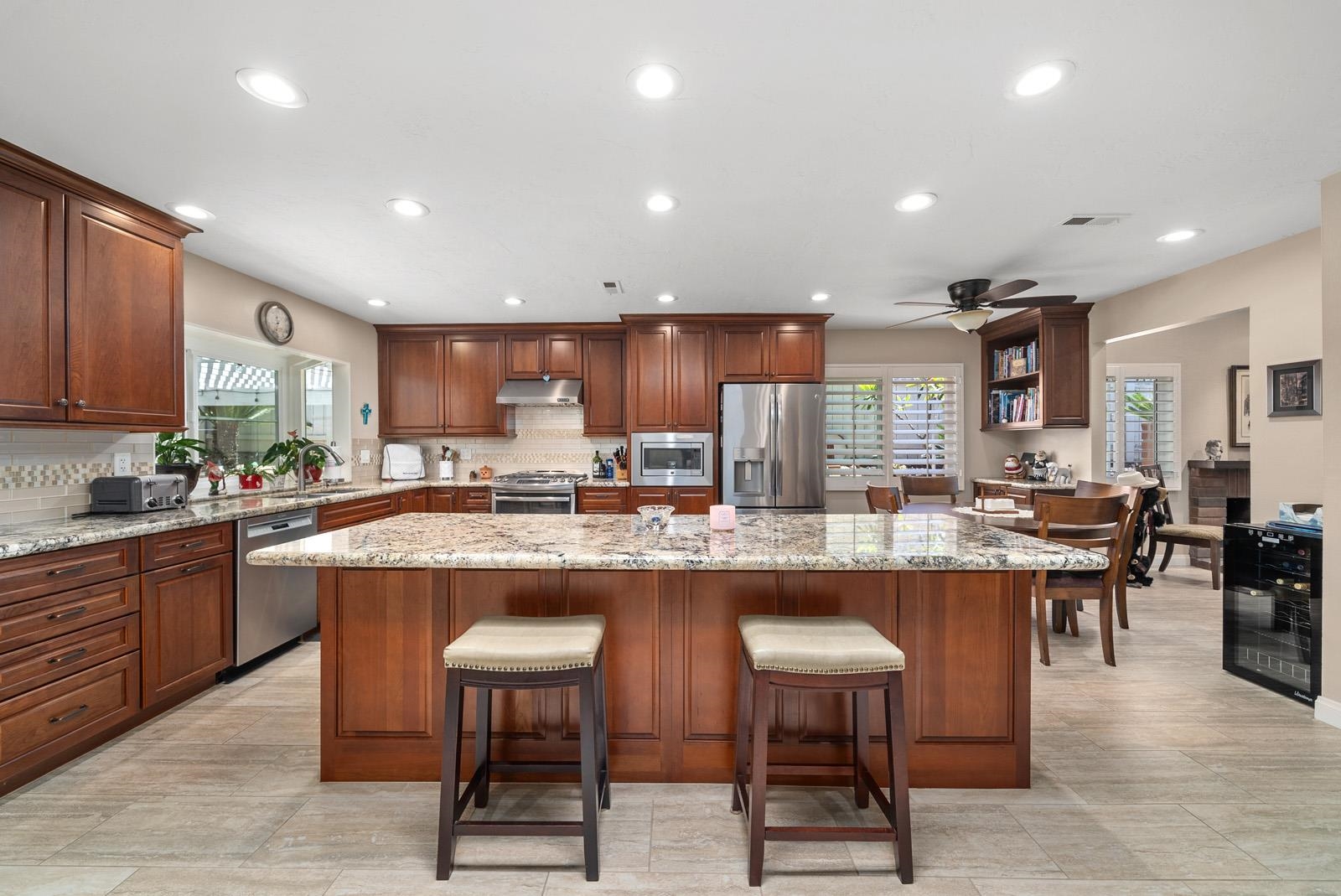 a kitchen with lots of counter top space and furniture