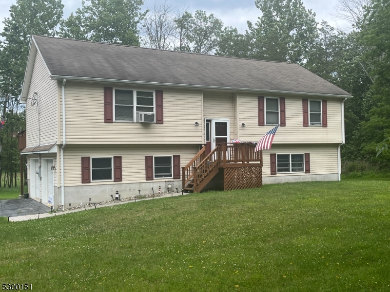 a house that has a big yard in front of it