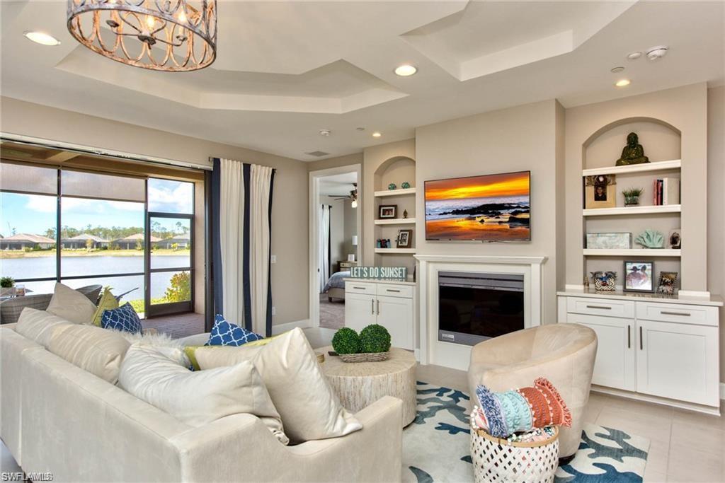 a living room with furniture fireplace and flat screen tv