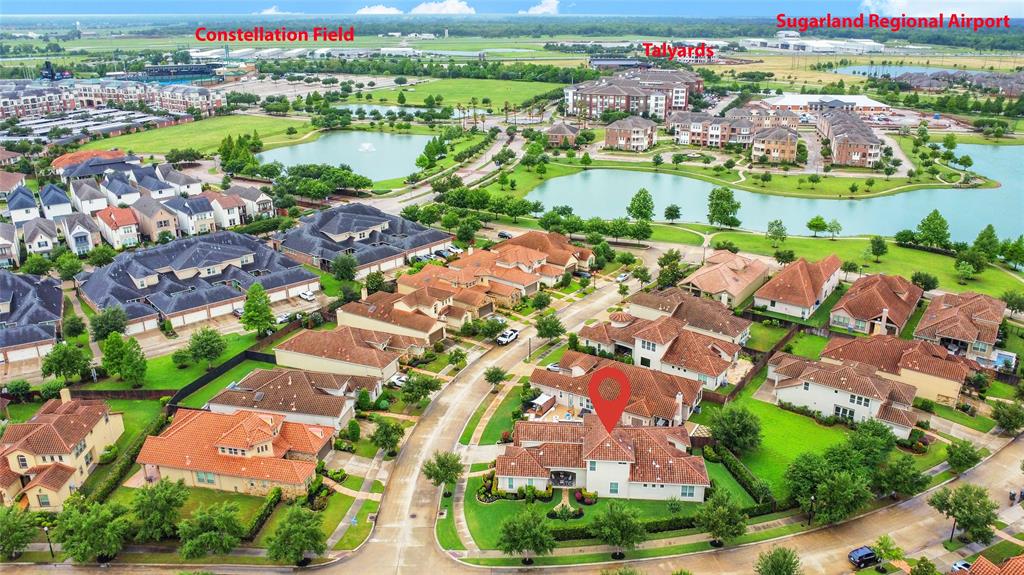 an aerial view of residential houses with outdoor space